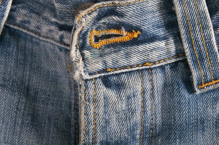 Top button hole on a pair of jeansの写真素材