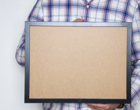 man holding an empty frame