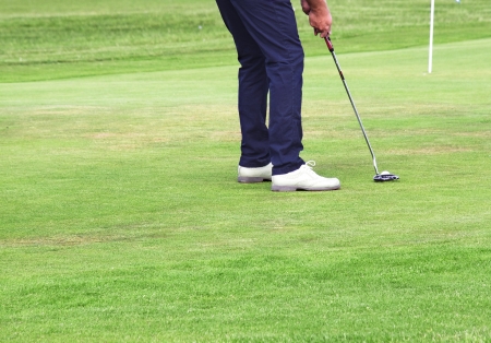 Golfer making the perfect putt.の写真素材