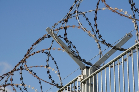 Razor and barbed wire fence.の写真素材