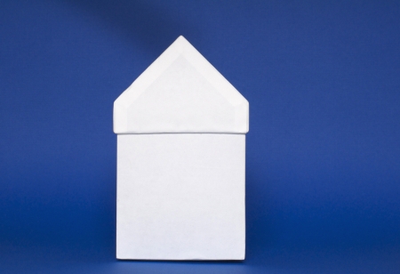 White carton house on blue backgroundの写真素材