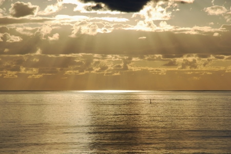 Sea, cloud and sunbeamの写真素材