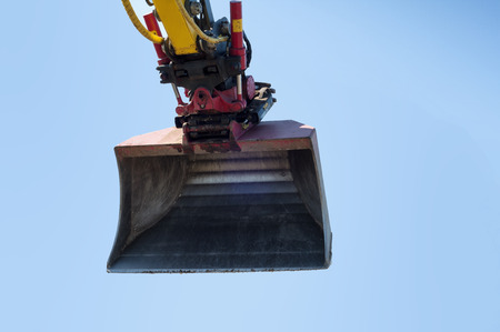Big excavator against a blue skyの写真素材