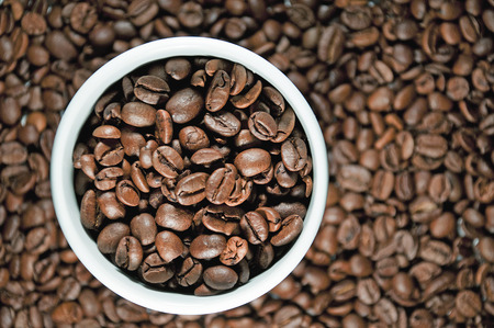 Coffee mug with coffee beansの写真素材
