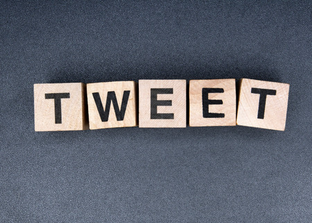 Wooden cubes spelling tweetの写真素材