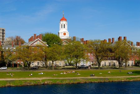 Spring view of Harvard University students relaxing on Charles River bankの写真素材