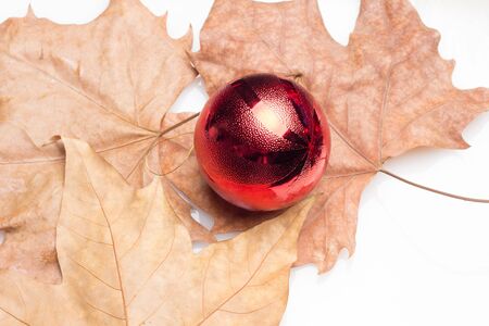 Red balls and tinsel, to decorate the Christmas trees and the interiors of the house to receive the Christmas holidays and the new year with family and loved onesの写真素材