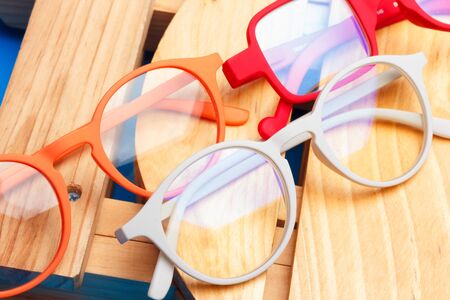 Glasses and lenses graduated on a plain background, with graduated glasses to be able to see either...