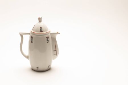 Classic ceramic container for serving hot drinks in particular to serve coffee or tea or herbal teas, ceramic container decorated with simple and abstract elements.の写真素材