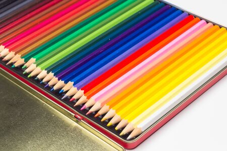 Colored pencils with a sharp point ready to draw and paint drawings; color with colors; color range from white to black through the entire color range, yellow, pink, green, blue, red, brown.の写真素材