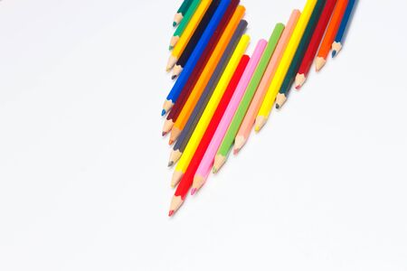 Colored pencils with a sharp point ready to draw and paint drawings; color with colors; color range from white to black through the entire color range, yellow, pink, green, blue, red, brown.の写真素材