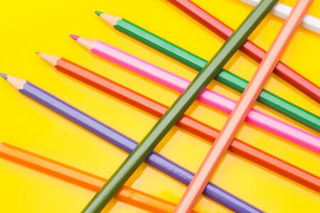Colored pencils with a sharp point ready to draw and paint drawings; color with colors; color range from white to black through the entire color range, yellow, pink, green, blue, red, brown.の写真素材