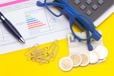 Diverse office supplies, clips, pencils, pen, staples, stapler, money, coins, compass; professional office or high school or university student office.の写真素材