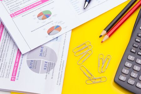 Diverse office supplies, clips, pencils, pen, staples, stapler, money, coins, compass; professional office or high school or university student office.の写真素材