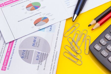 Diverse office supplies, clips, pencils, pen, staples, stapler, money, coins, compass; professional office or high school or university student office.の写真素材