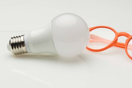 Low consumption, less heat, responsible consumption with energy; energy saving light bulbs and maximum brightness to see well, read well; Perfectly illuminate our home and our workplace. Saving money.の写真素材