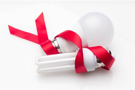 Low consumption, less heat, responsible consumption with energy; energy saving light bulbs and maximum brightness to see well, read well; Perfectly illuminate our home and our workplace. Saving money.の写真素材