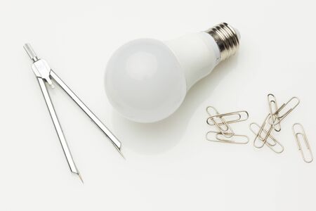 Low consumption, less heat, responsible consumption with energy; energy saving light bulbs and...