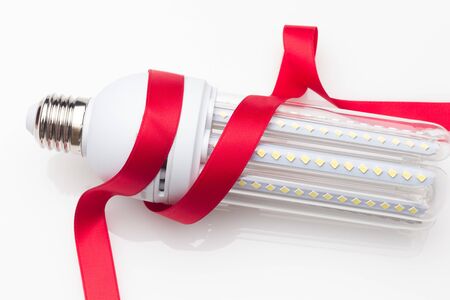 Low consumption, less heat, responsible consumption with energy; energy saving light bulbs and...