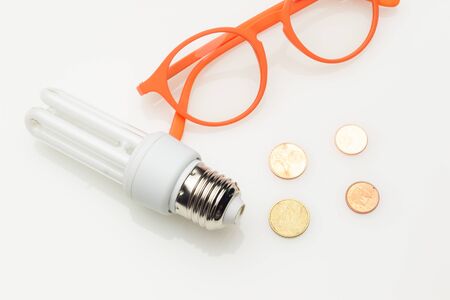 Low consumption, less heat, responsible consumption with energy; energy saving light bulbs and...