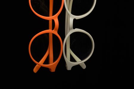 Vision corrective glasses with corrected glasses for perfect vision, to see near and far. Designer lenses with different colorsの写真素材