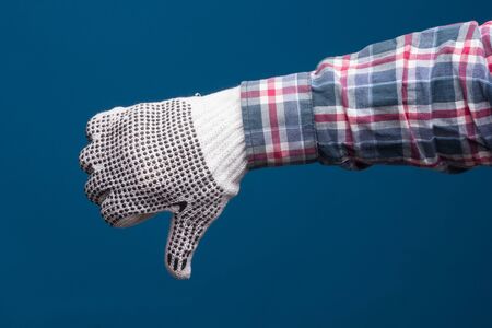 Professional hands protected with industrial gloves. Gloves for hand protection. Hands with medicine products, industrial products, glasses, medicine cabinet.の写真素材