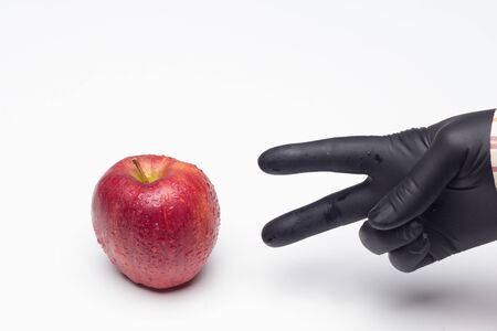 The symbol apple in science and fantasy literature. Sweet fruit full of vitamins, healthy and low in calories. Red apple, ideal for making desserts and for eating before and after meals.の写真素材