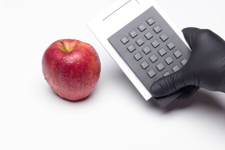 The symbol apple in science and fantasy literature. Sweet fruit full of vitamins, healthy and low in calories. Red apple, ideal for making desserts and for eating before and after meals.の写真素材