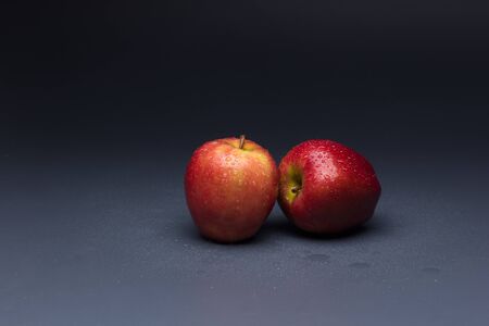 Tomatoes and apples, red fruits, for salads to eat raw, full of vitamins and few calories ideal for dieting.の写真素材