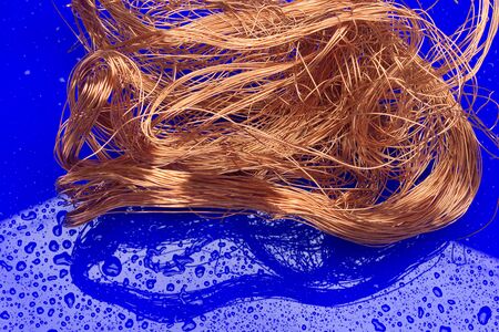 Copper filaments, small transmitting wires and carriers of electric current. Essential copper cables for the transport of electricity.の写真素材