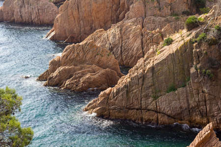 Costa Brava, Baix Ampurdan, Catalonia, Spain; where the mountain reaches the sea, the pines touch the Mediterranean water, blue water, blue sky.の写真素材