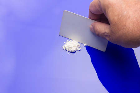 White powders, lines of white powders, addictive, dangerous and illegal drug. Traffic in dangerous substances, mafias. Drug trafficking, substance use. Consumption of drugs. Drug addiction.の写真素材