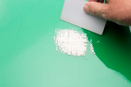 White powders, lines of white powders, addictive, dangerous and illegal drug. Traffic in dangerous substances, mafias. Drug trafficking, substance use. Consumption of drugs. Drug addiction.の写真素材