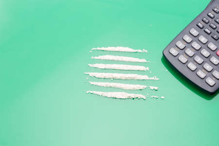 White powders, lines of white powders, addictive, dangerous and illegal drug. Traffic in dangerous substances, mafias. Drug trafficking, substance use. Consumption of drugs. Drug addiction.の写真素材