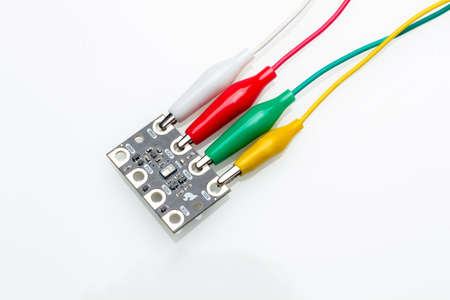 Part with electronic components and electrical cables of different colors that is part of a complex...