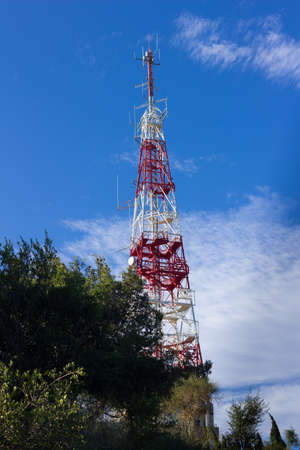 Telecommunications tower with clear blue sky.のeditorial素材