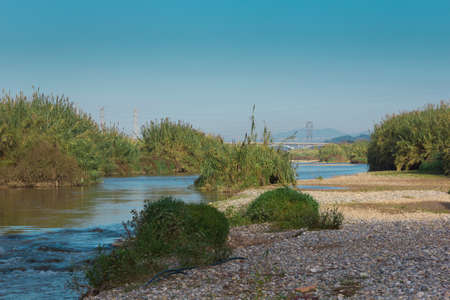 The Llobregat River as it passes through the Baix Llobregat region, province of Barcelona,...