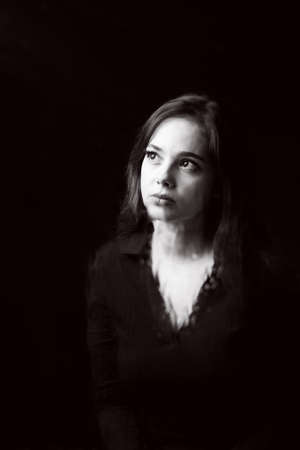 Young, pretty girl, pensive, depressed, melancholic, thinking about her future or her experiences; Lack of work.の写真素材