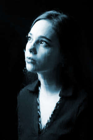 Young, pretty girl, pensive, depressed, melancholic, thinking about her future or her experiences;...