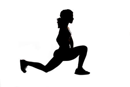 Athlete warming up before training to avoid injury.の写真素材