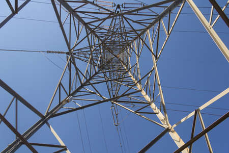 An electric tower in the mountains, overcoming the mountainous terrain to bring electricity to...