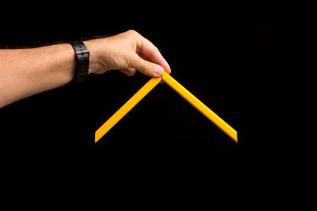 Different colors in the hand showing the camera simple and primary colors, bright colors on a black background.の写真素材