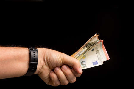 Make debt repayments or save money for the future, deposit cash in the bank. Investing in financial institutions. Black money.の写真素材