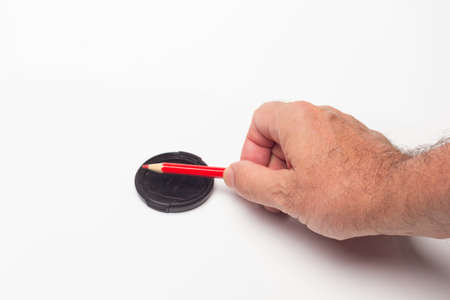 Colored pencil on a white background to start a drawing or a letter or used to measure proportions;...