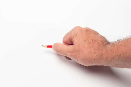 Colored pencil on a white background to start a drawing or a letter or used to measure proportions;...