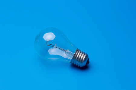 Traditional transparent glass bulb, bulb that works with electric energy, heating the filaments and...