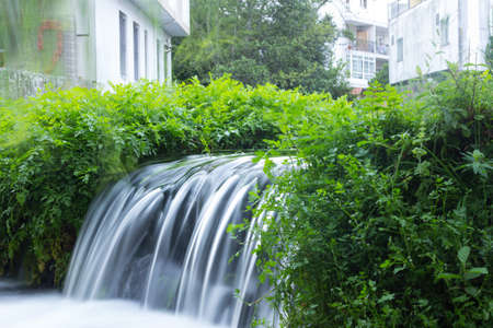 Small waterfalls; waterfalls. Nature. Foam generated by the waterfall. Water in movement.の写真素材