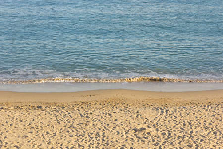 Small waves on the shore of the beach