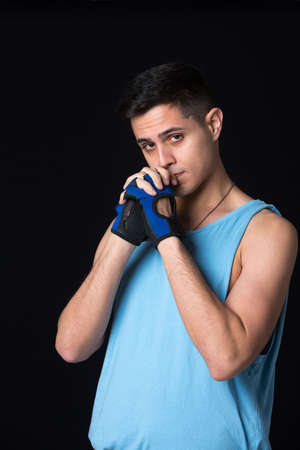 Young boy photographed in studio in sports attire