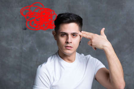 symbolically shooting yourself with the fingers of your handの写真素材